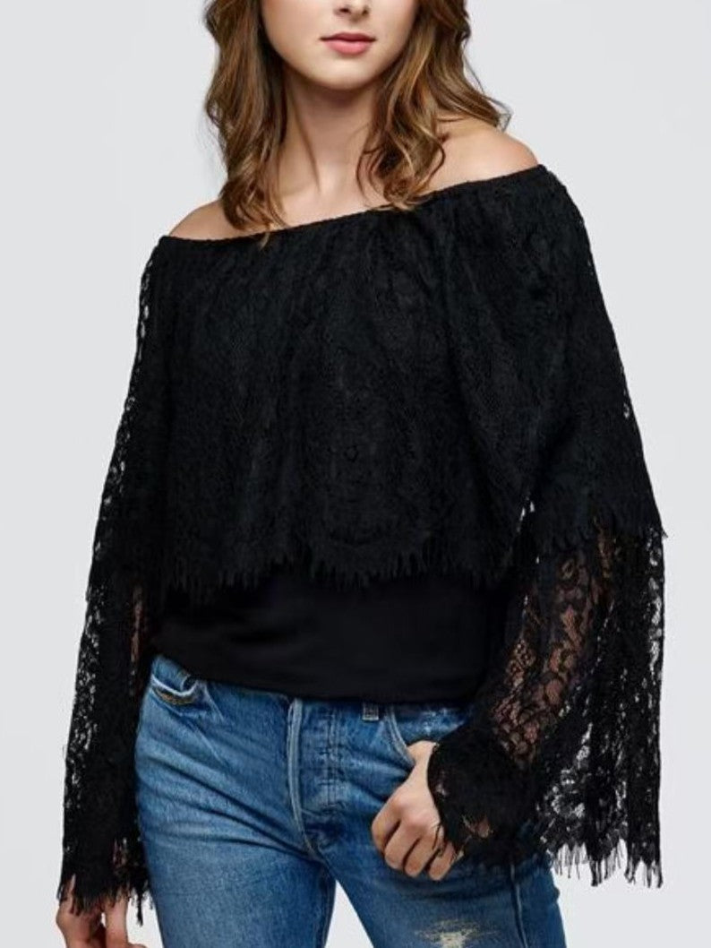 Soft lace, effortless allure.   Off-the-shoulder lace blouse with delicate eyelash trim and sheer bell sleeves.